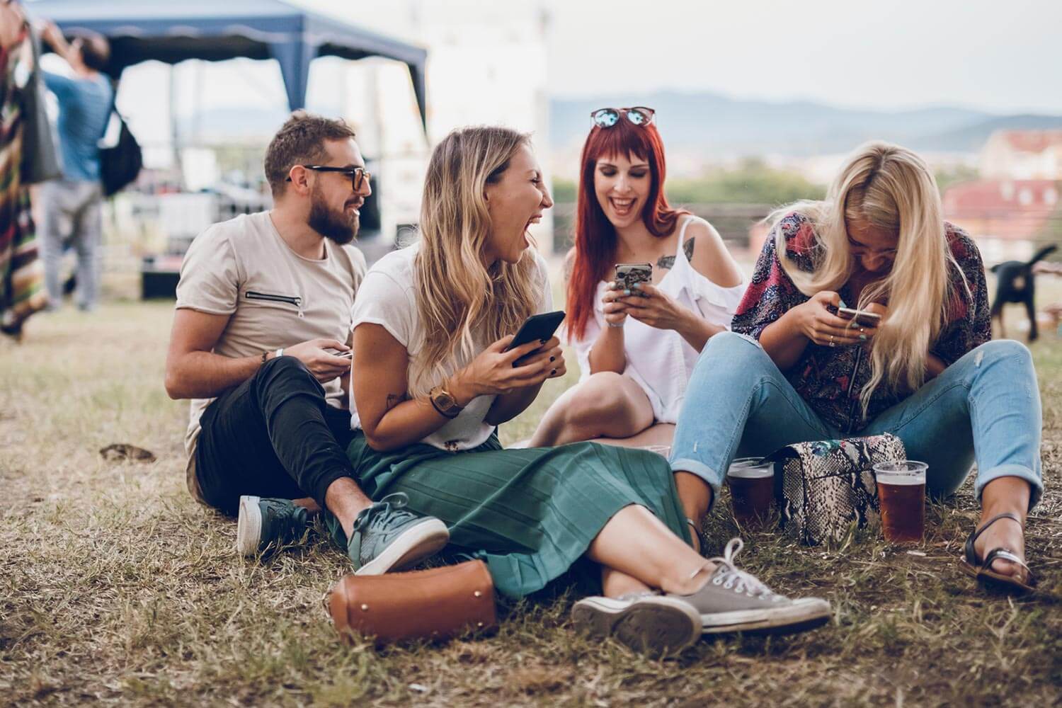 group of friends sat on grass group of friends sat on grass