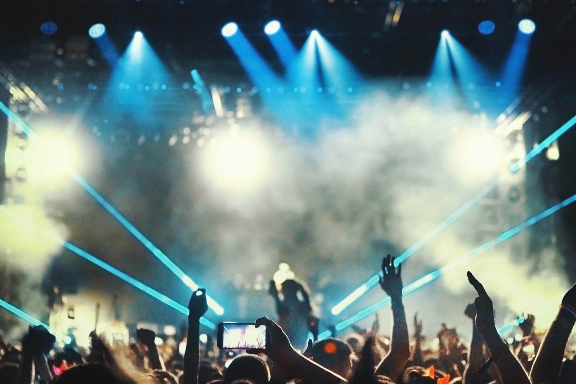 large group of people at a gig large group of people at a gig