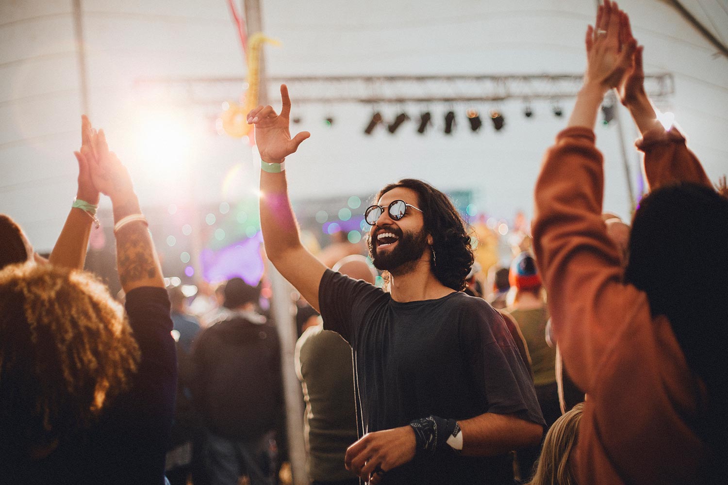 man at festival smiling and dancing man at festival smiling and dancing