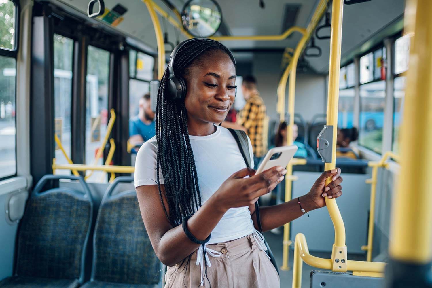 young woman on public transport looking at her phone young woman on public transport looking at her phone
